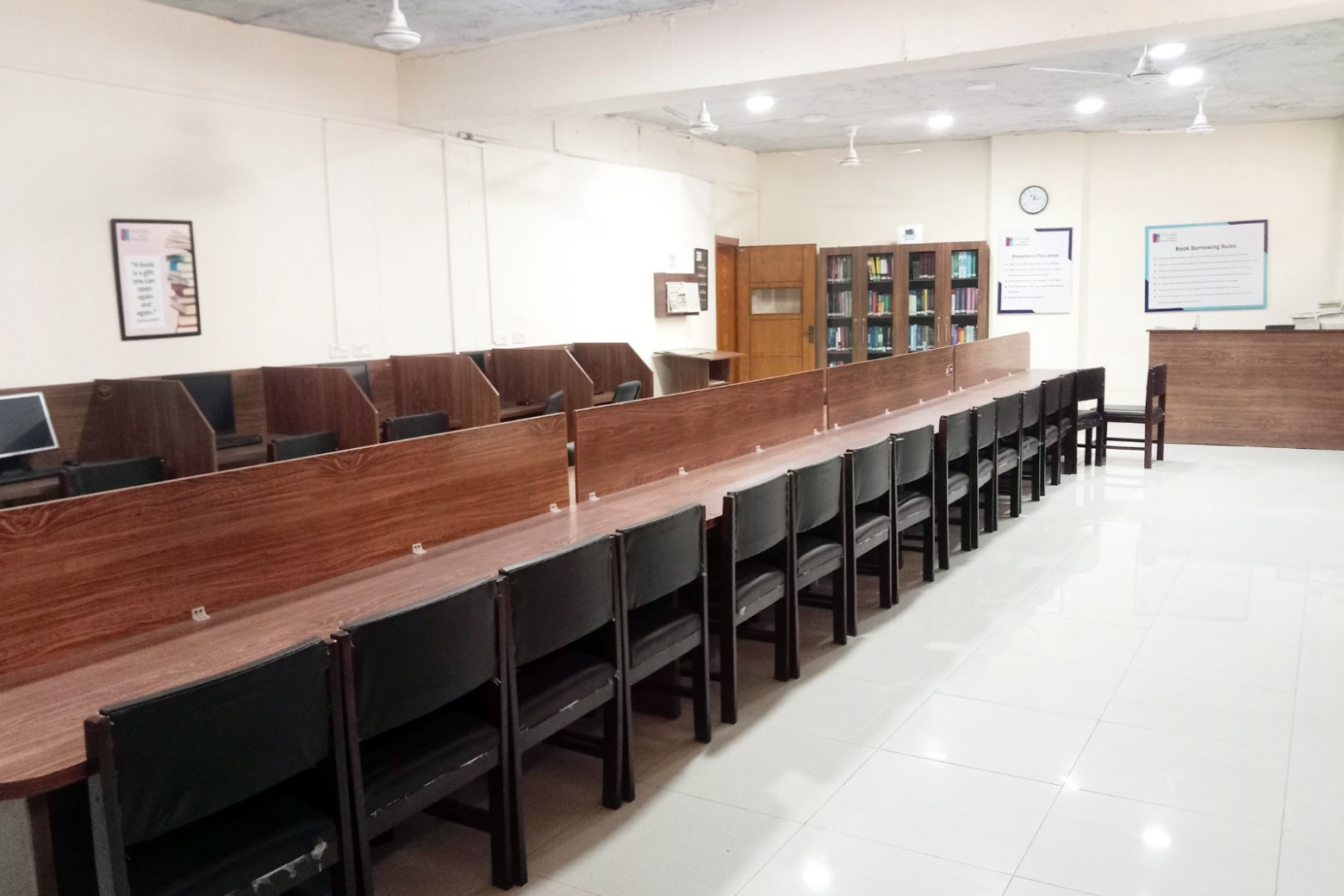 KIHS campus library with organized bookshelves and study areas