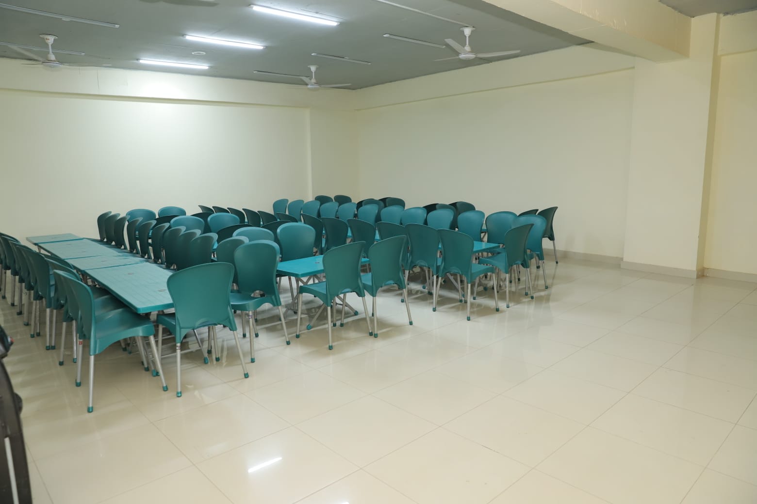 Campus facilities in KIHS featuring neatly arranged cafe chairs for student interaction