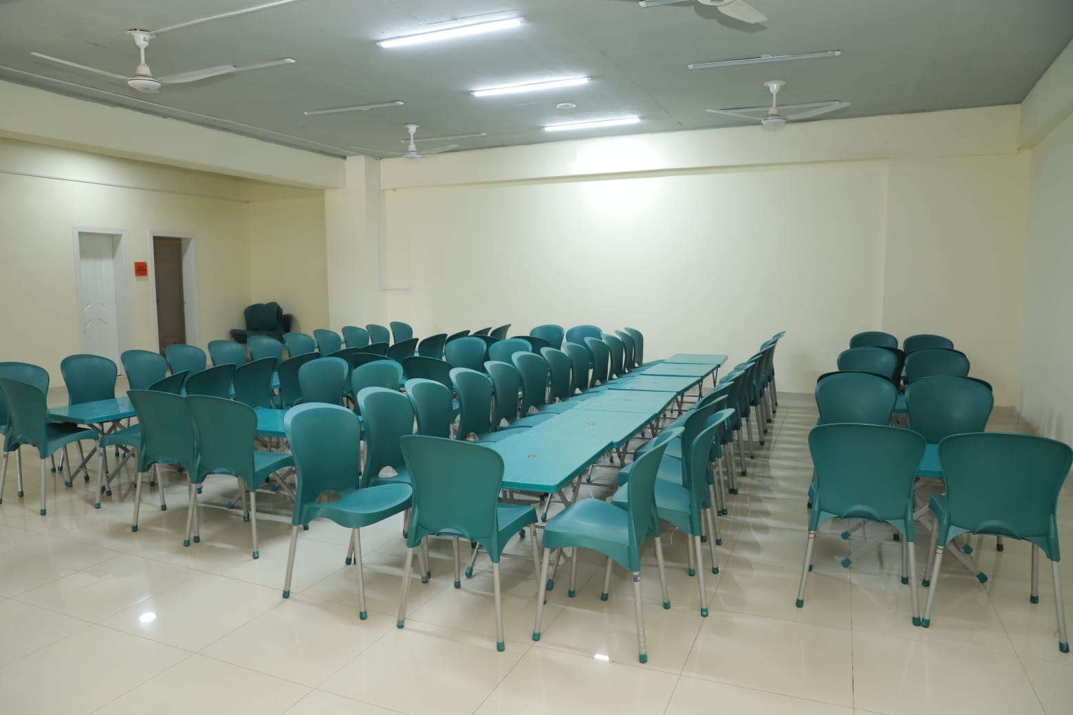 KIHS campus facilities include a welcoming lounge space with organized cafe-style seating.