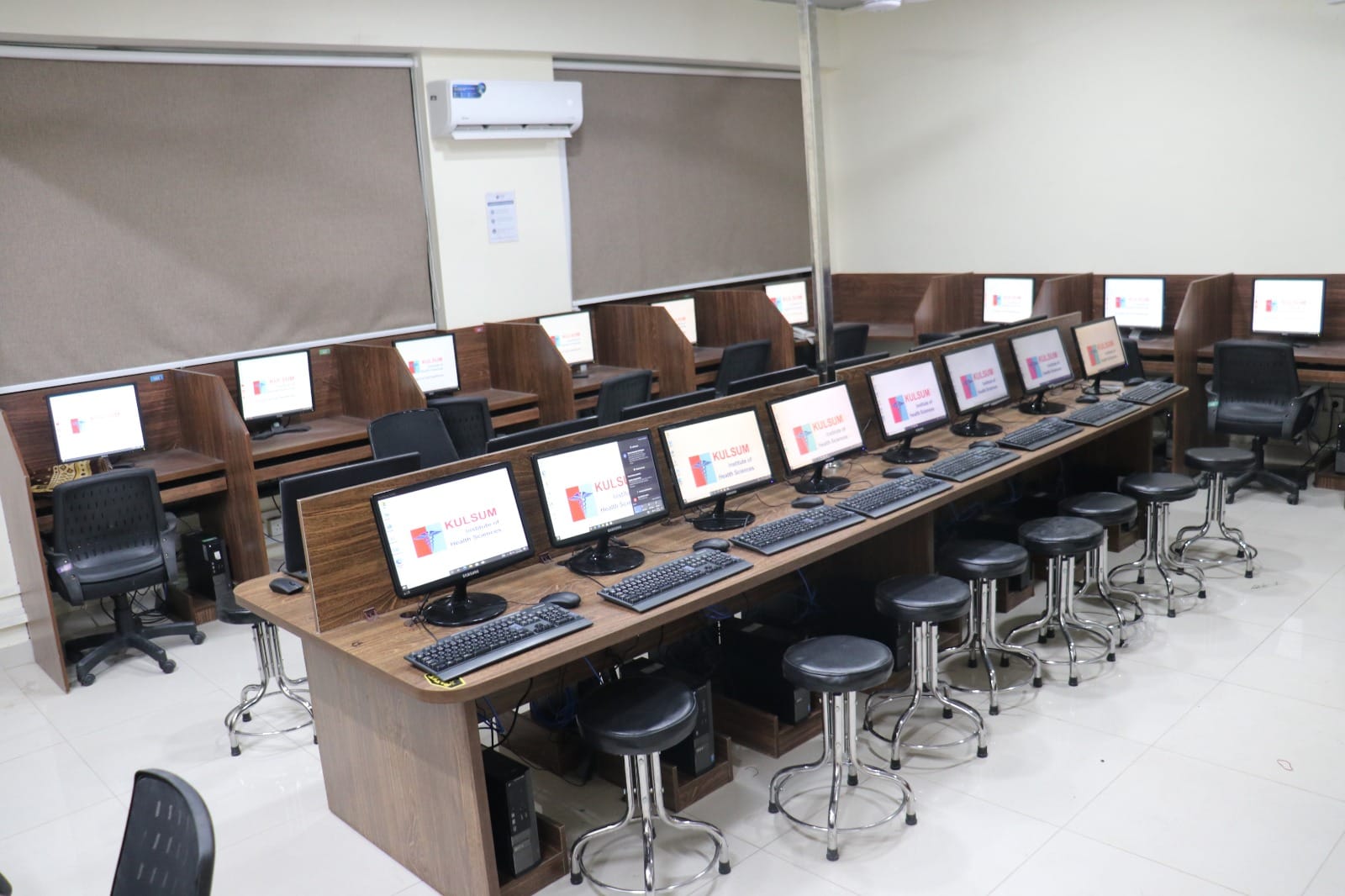campus facilities in KIHS - computer lab with all desktop systems ready for student use