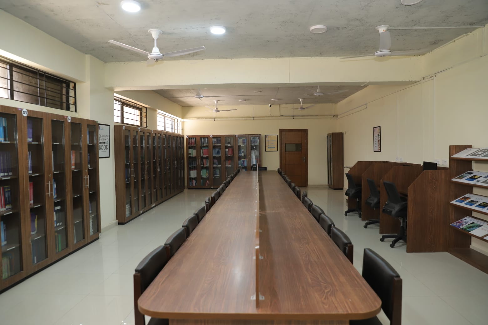 Organized library space with bookshelves and seating at KIHS – Campus Facilities at KIHSe